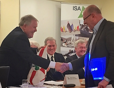 HYC's Robert Dix is presented with his ISA burgee by President David Lovegrove