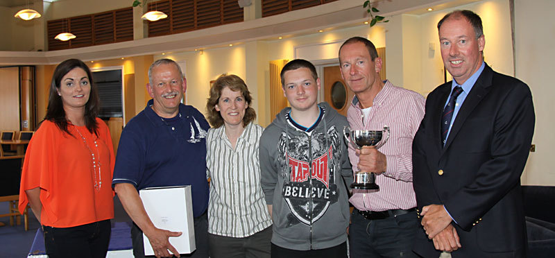 Charlotte O'Connor, crew of handicap winners 'Shiggy' with skipper Gerry Kennedy and Commodore Brian Turvey on right