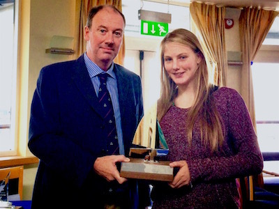 Commodore Brian Turvey presents the GM Trophy to Aoife Hopkins
