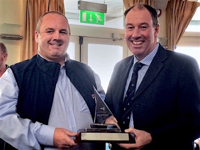 'Checkmate's' Dave Cullen accepts the Boat of the Year Award from Commodore Brian Turvey