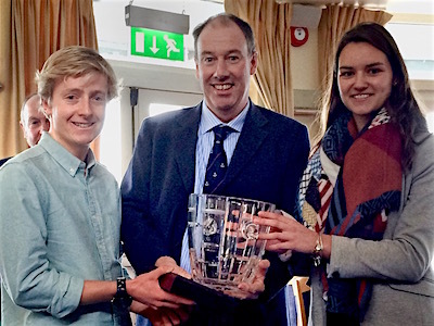 Ush Hamilton and Georgina Corbett are jointly presented with the 'Instructor of the Year Trophy' by Commodore Brian Turvey. Ush travelled from Galway to collect the prize, while Georgina had flown from Spain for the Awards 