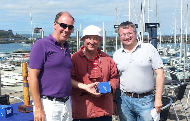Peter Courtney collects 2nd prize from Commodore Brian Turvey and Marcus Lynch