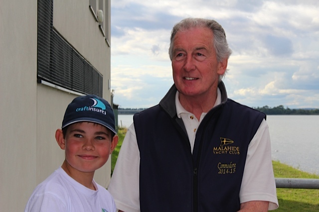 MYC Commodore presents Dylan McEvoy with his prize for 3rd place in the Optimist Silver Fleet