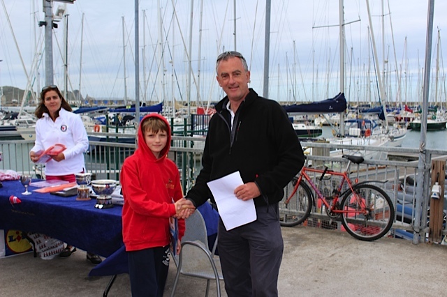 Jack McDowell recieves his Regatta Fleet 3rd place prize from Rear Commodore Richard Kissane