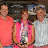 Steffi Ennis is presented 'Demelza's' prize for White Sails ECHO by Barry Gibney and Dermot Skehan