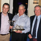 Pat Kelly (Storm) collects the 'Jim Keller Trophy' from Ross McDonald and Commodore Berchmans Gannon
