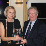 Wendy Morrison (Toughnut) collects the 'Audrey Pearson Trophy' from Commodore Berchmans Gannon