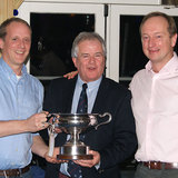 Commodore Berchmans Gannon with Michael and Richard Evans and the 'Mischief Cup'