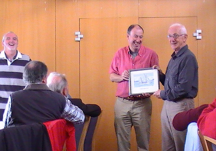 Joe Phelan accepts the Asgard II prize from the Commodore
