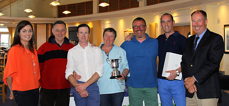 Charlotte O'Connor (Sutton Cross Pharmacy) and Commodore Brian Turvey presented the Championship Trophy to Scorie Walls and the winning 'Gold Dust' team