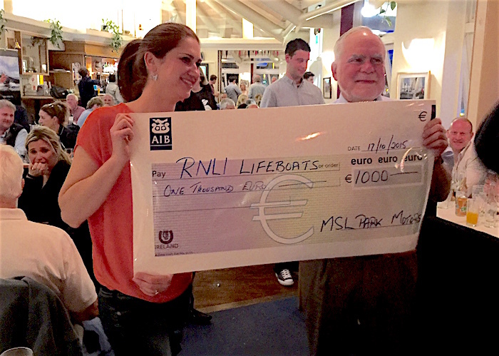 Joanne Kavanagh of MSL Park Motors presents a cheque for €1000 to Howth RNLI's Rupert Jeffares