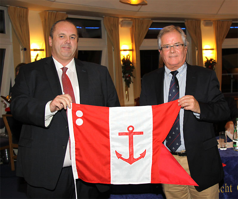 Rear Commodore David Cullen accepts his burgee from the Commodore