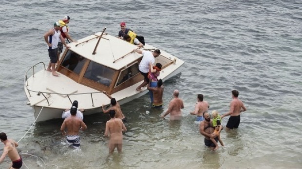 The race committee boat is rescued from a nudist beach!