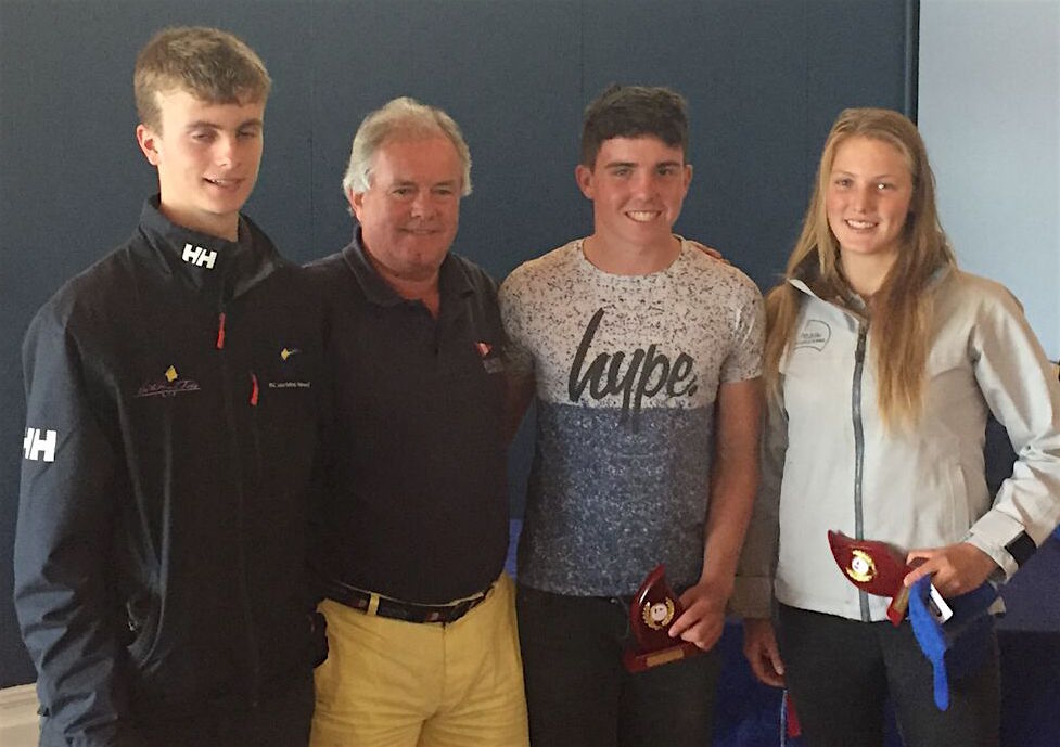 The Laser Radial podium with Aaron Rogers (3rd), Commodore Berchmans Gannon, Loghlen Rickard (2nd) and Aoife Hopkins (1st)