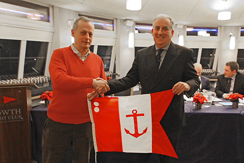 Ian Malcolm is presented with the Rear Commodore's Flag
