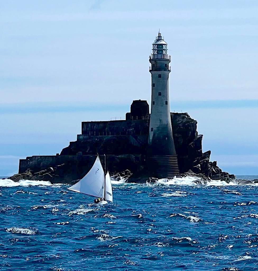 'Aura' approaches the Fastnet Rock. Ian Malcolm's classic is older than the lighthouse