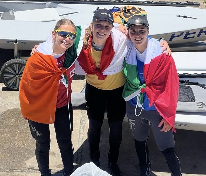 Sienna, Roos and Emma all wrapped in their respective national flags after Friday's finish
