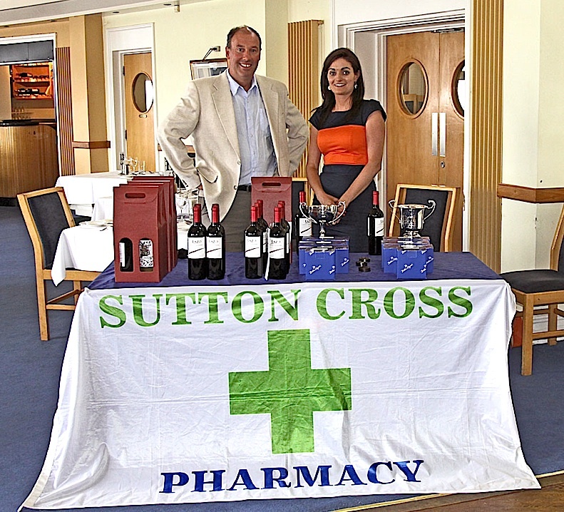 Commodore Brian Turvey with Charlotte O'Connor from Sutton Cross Pharmacy