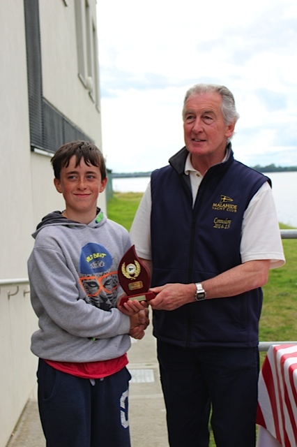 Max Kavanagh collect top Optimist Gold Fleet prize from MYC Commodore Graham Smith