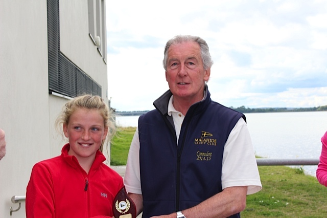 Eve McMahon collects her 2nd place prize in the Optimist Silver Fleet