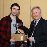 Ronan Cull is presented with the Courtney Cup by Vice Commodore Berchmans Gannon 6332.jpg