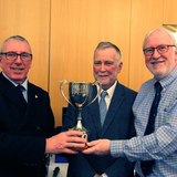 Ian Byrne (Commodore) and John Connolly awarding  Clifford Brown the Mutec trophy as winner of the Photographic Competition