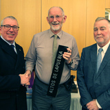 Ian_Byrne_(Commodore)_and_John_Connolly_awarding_Pat_Murphy_Fourth_prize_for_the_Photographic_Competition.jpg