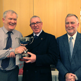 Willie_Kearney_(_Cruising_Group_Captain)_being_awarded_the_New__Phelim_Connolly_Memorial_Cup_by_John_Connolly_and_Ian_Byrne_(_Commodore).jpg