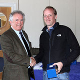 Vice_Commodore_Berchmans_Gannon_presents_Richard_Evans_(The_Big_Picture)_with_his_prize.jpg