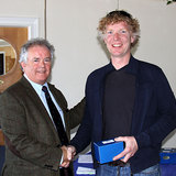 Vice_Commodore_Berchmans_Gannon_presents_Shane_Murphy_(Dinghy_Supplies)_with_his_prize.jpg